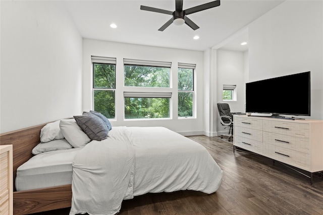 bedroom featuring ceiling fan and dark wood-type flooring