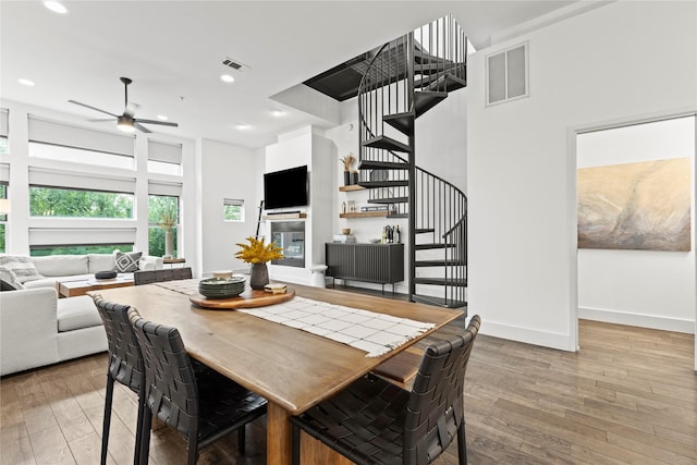 dining room featuring hardwood / wood-style floors and ceiling fan