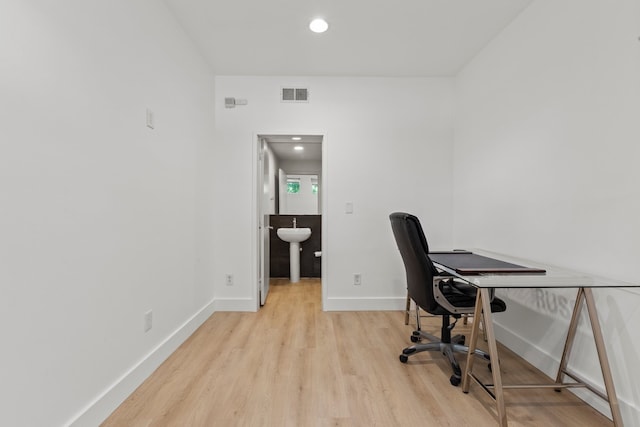 office space featuring light wood-type flooring