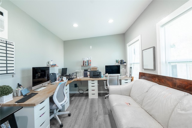 office with light hardwood / wood-style flooring