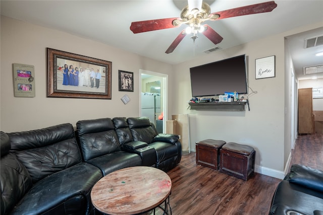 living room with ceiling fan and dark hardwood / wood-style floors