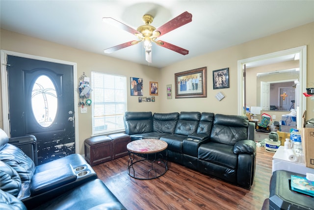 living room with dark wood-type flooring and ceiling fan