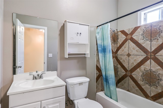 full bathroom with vanity with extensive cabinet space, toilet, and shower / bath combo