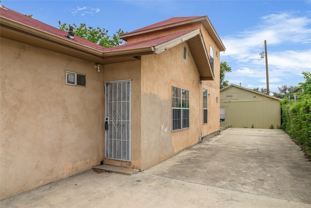 view of side of property featuring a patio area