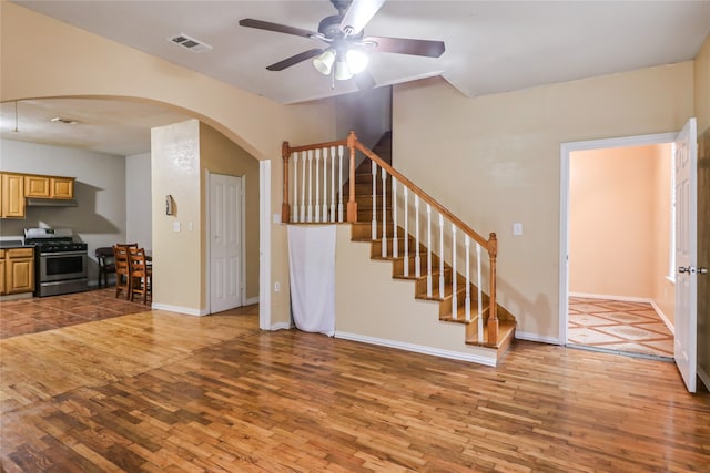 living room featuring hardwood / wood-style flooring and ceiling fan