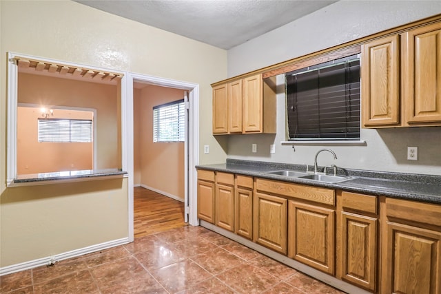 kitchen with sink and light tile floors