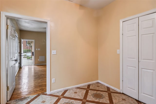 unfurnished bedroom featuring a closet and wood-type flooring