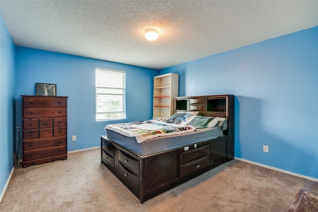 carpeted bedroom with a textured ceiling