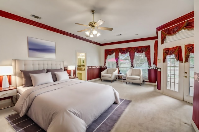 carpeted bedroom featuring connected bathroom, access to outside, ceiling fan, and ornamental molding