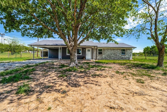 single story home with a carport