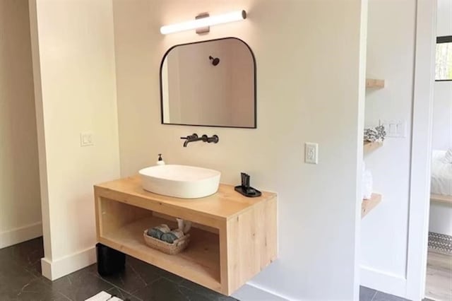 bathroom featuring tile flooring and vanity