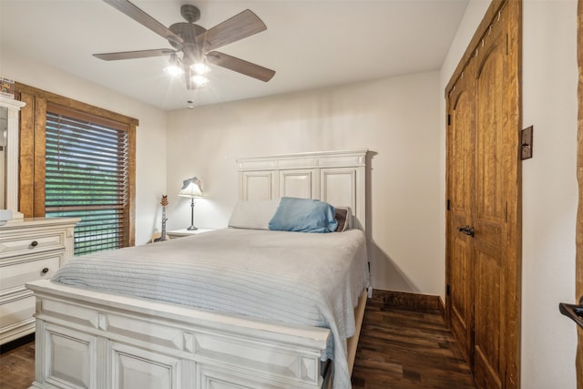 bedroom with ceiling fan and dark hardwood / wood-style floors