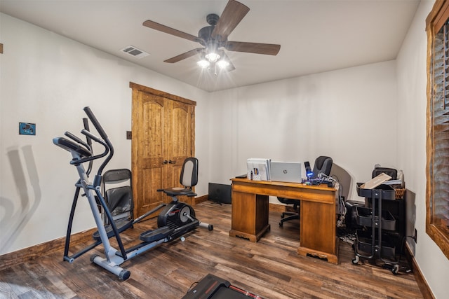 home office featuring ceiling fan and dark wood-type flooring