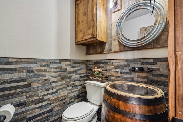 bathroom featuring decorative backsplash, vanity, and toilet