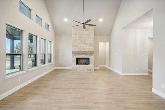 1176 Paradise Pkwy, Poolville, TX 76487 - unfurnished living room with a ceiling fan, high vaulted ceiling, a stone fireplace, light wood-style floors, and recessed lighting