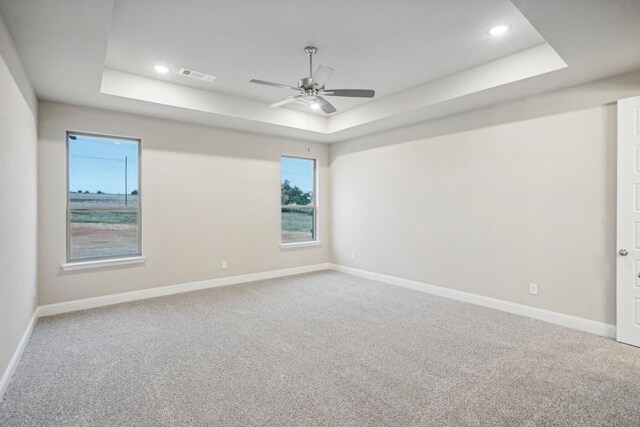 1176 Paradise Pkwy, Poolville, TX 76487 - spare room with a tray ceiling, carpet floors, ceiling fan, and recessed lighting