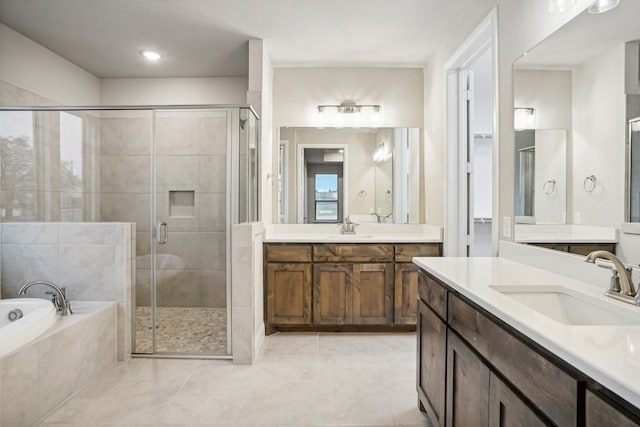 bathroom with separate shower and tub, tile patterned flooring, and vanity