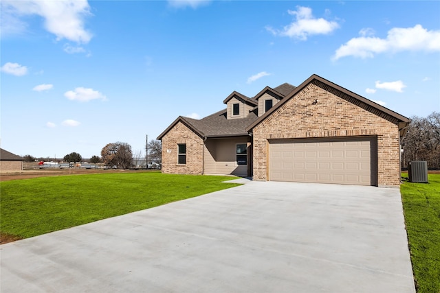 view of front of house featuring brick siding, a garage, concrete driveway, and a front yard