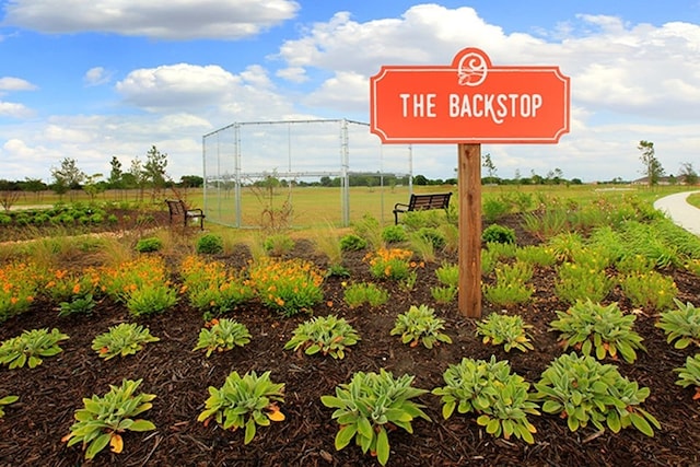 community sign featuring a rural view