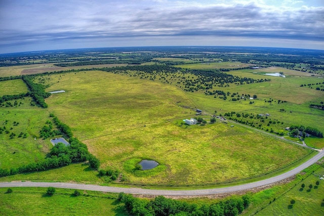 birds eye view of property featuring a rural view