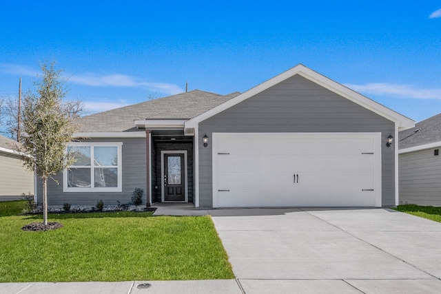 ranch-style home featuring a front lawn and a garage