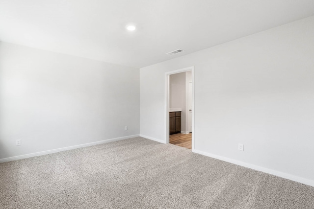 spare room with light colored carpet