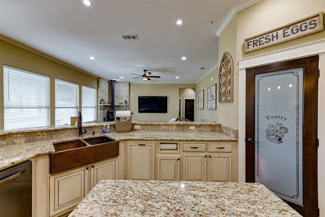 kitchen with dishwasher, ceiling fan, sink, and cream cabinets