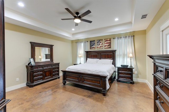 bedroom featuring ceiling fan and a raised ceiling