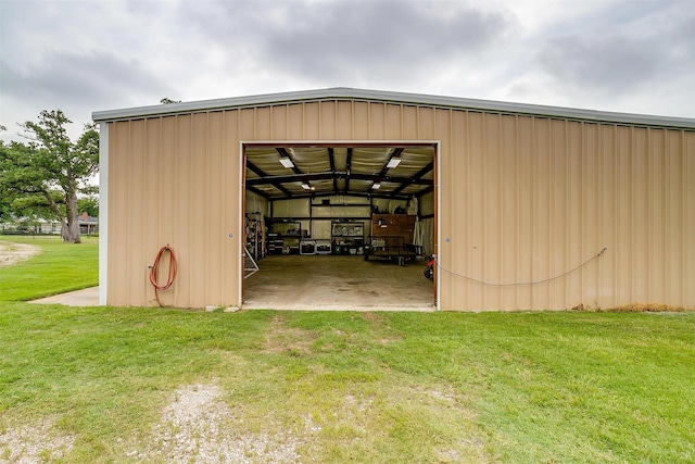 view of outdoor structure featuring a lawn