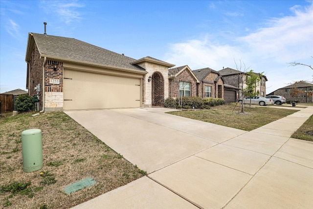 single story home featuring a front yard and a garage