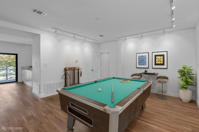 rec room featuring rail lighting, light hardwood / wood-style floors, and billiards