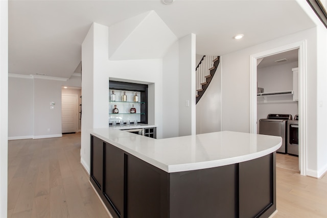 interior space with washer and clothes dryer and light wood-type flooring