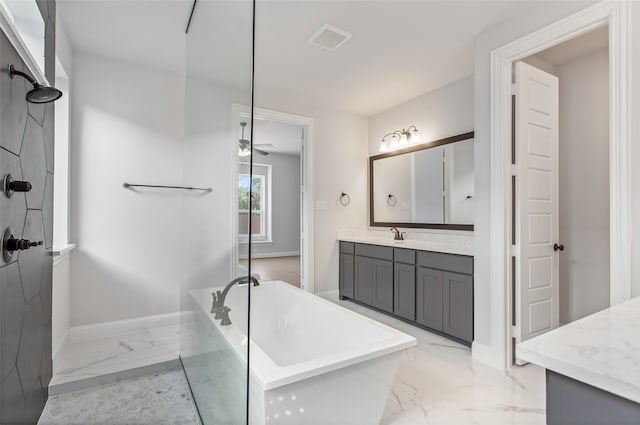 bathroom with ceiling fan, tile flooring, vanity, and a bathtub