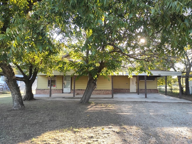 obstructed view of property with a carport