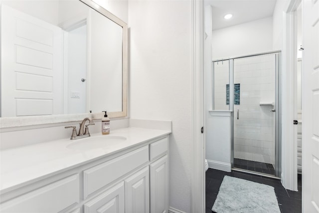 bathroom with a shower with shower door, toilet, tile flooring, and vanity