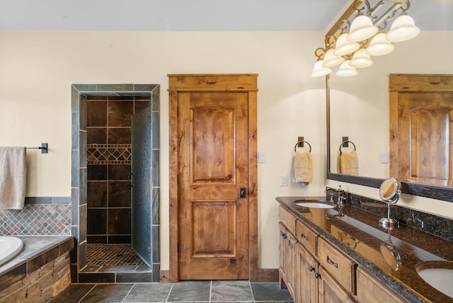 bathroom with dual bowl vanity, tile floors, and shower with separate bathtub