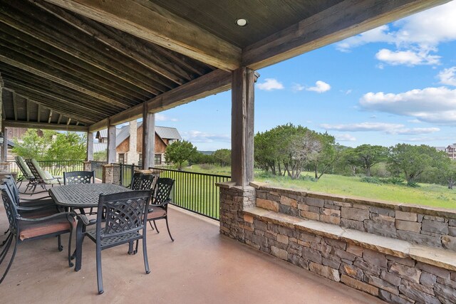 view of terrace featuring a balcony, an outdoor kitchen, and grilling area