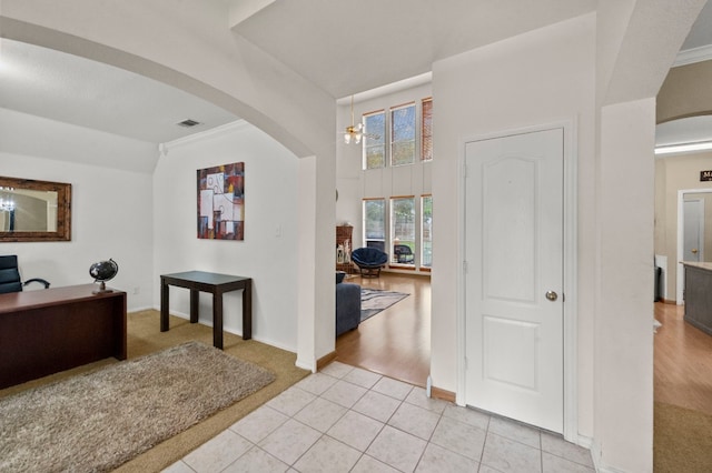 hallway featuring light tile floors