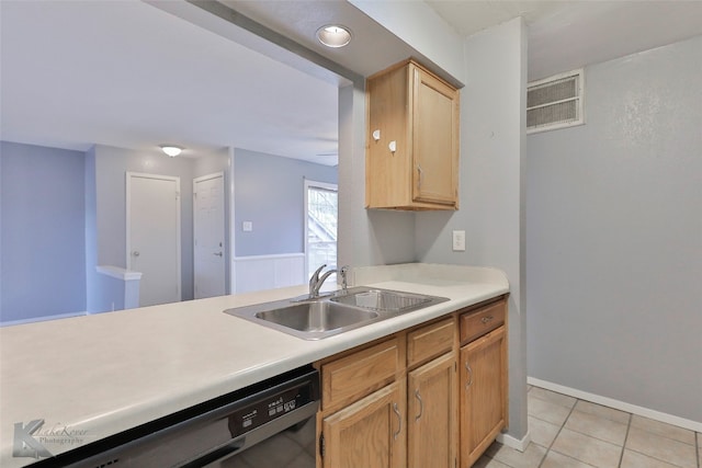 kitchen featuring sink, light tile floors, and stainless steel dishwasher