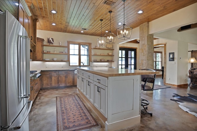 205 Haciendas Dr, Weatherford, TX 76087 - kitchen featuring freestanding refrigerator, open shelves, finished concrete floors, butcher block countertops, and recessed lighting