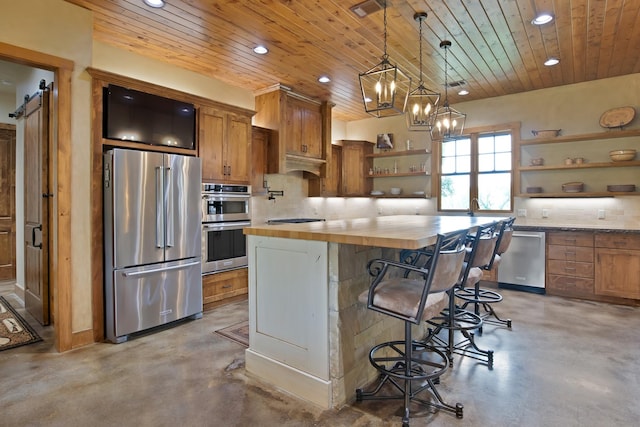 205 Haciendas Dr, Weatherford, TX 76087 - kitchen with stainless steel appliances, open shelves, finished concrete floors, recessed lighting, and butcher block countertops