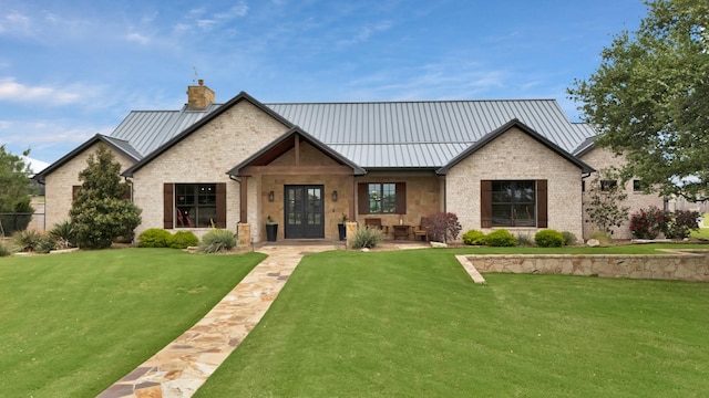 205 Haciendas Dr, Weatherford, TX 76087 - modern farmhouse style home featuring a chimney, a front yard, and a standing seam roof
