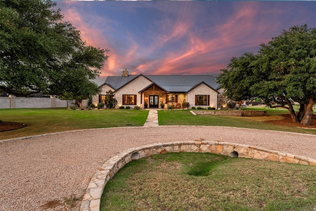 modern farmhouse style home with a yard