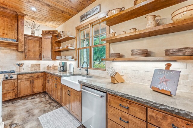 kitchen with dark stone countertops, vaulted ceiling, dishwasher, and tasteful backsplash