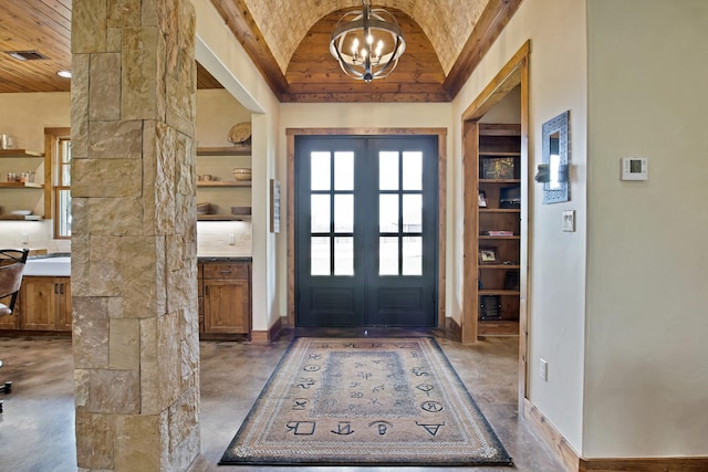 205 Haciendas Dr, Weatherford, TX 76087 - entryway with lofted ceiling, a chandelier, wood ceiling, and baseboards