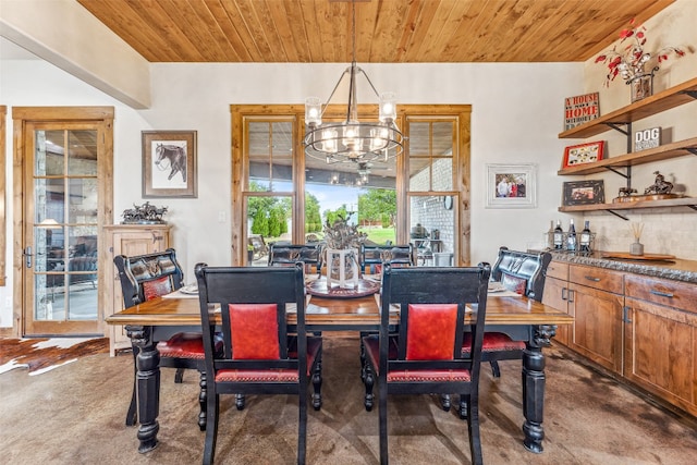 dining room featuring dark colored carpet, an inviting chandelier, and wood ceiling