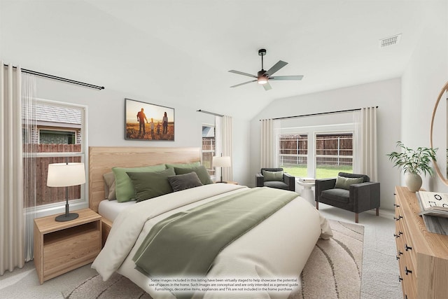 carpeted bedroom with lofted ceiling and ceiling fan