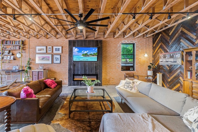 living room with brick wall, wood ceiling, beam ceiling, and ceiling fan