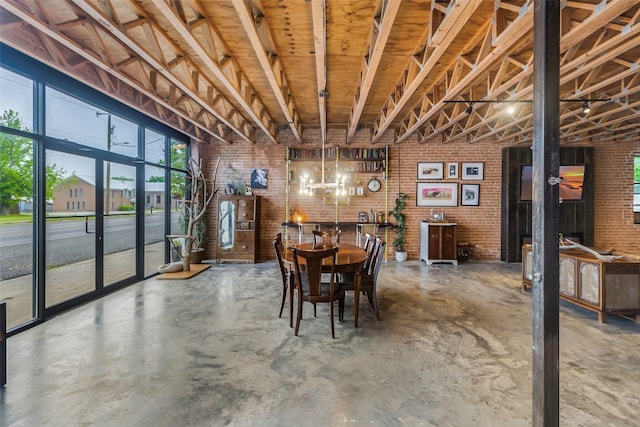 dining room with brick wall