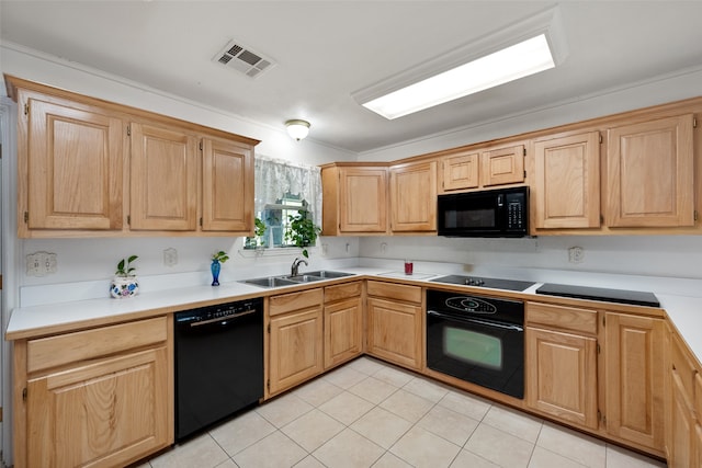 kitchen featuring black appliances, sink, light tile patterned floors, and ornamental molding